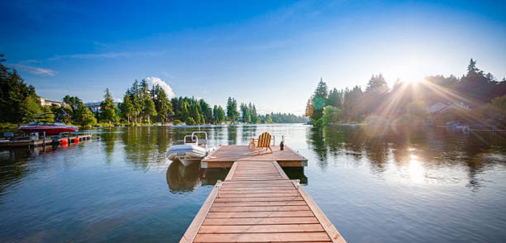 Dock With A Wooden Chair And Boat
